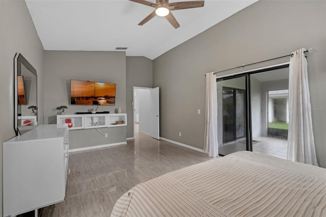 5729 Norman H Cutson Dr, Orlando, FL 32821 - bedroom with lofted ceiling, access to outside, baseboards, and a ceiling fan
