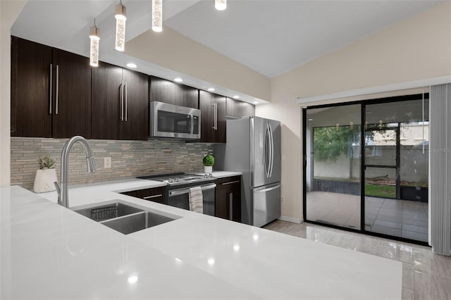 5729 Norman H Cutson Dr, Orlando, FL 32821 - kitchen featuring stainless steel appliances, a sink, light countertops, tasteful backsplash, and recessed lighting