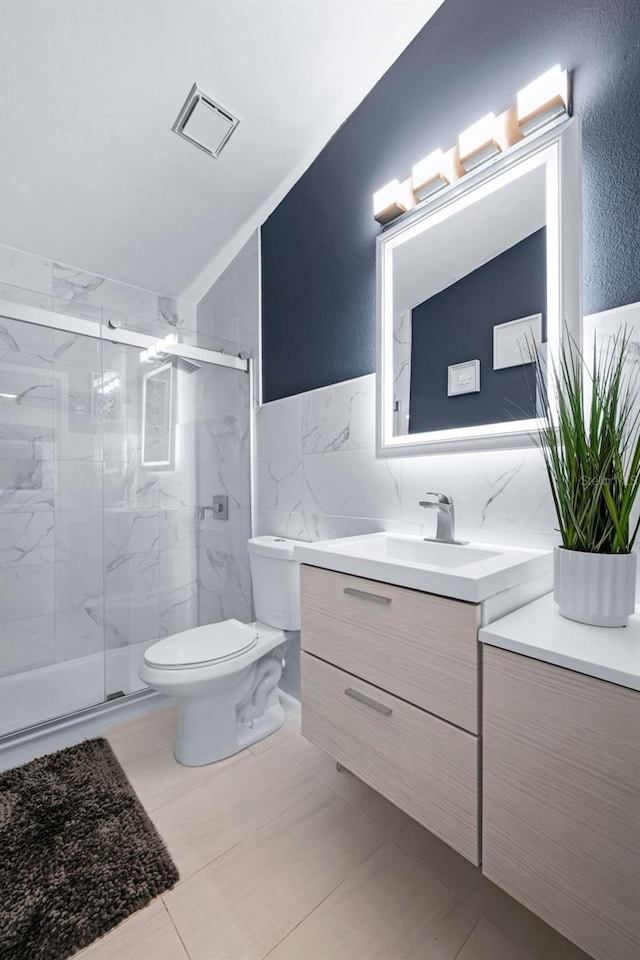 5729 Norman H Cutson Dr, Orlando, FL 32821 - bathroom featuring toilet, vanity, and a marble finish shower
