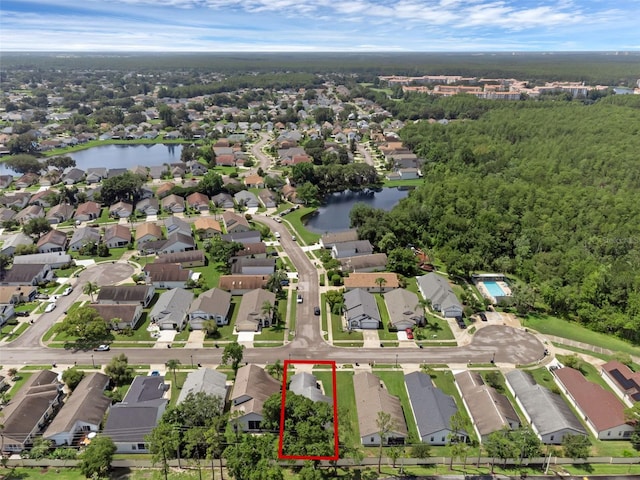 5729 Norman H Cutson Dr, Orlando, FL 32821 - aerial view of residential area featuring property parcel outlined and a large body of water