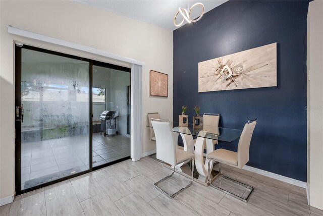 5729 Norman H Cutson Dr, Orlando, FL 32821 - dining area featuring baseboards and wood finished floors