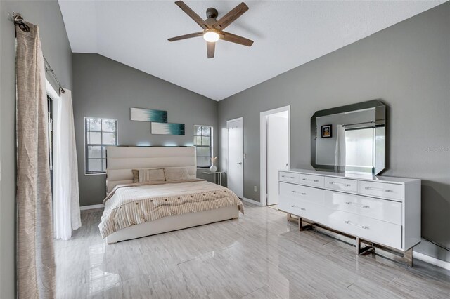 5729 Norman H Cutson Dr, Orlando, FL 32821 - bedroom with lofted ceiling, baseboards, and a ceiling fan