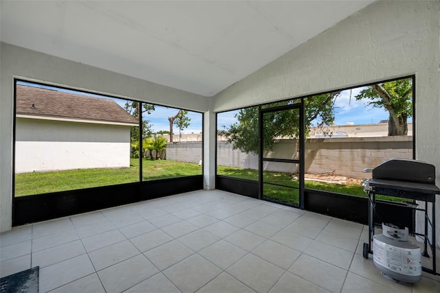 5729 Norman H Cutson Dr, Orlando, FL 32821 - unfurnished sunroom with lofted ceiling and plenty of natural light