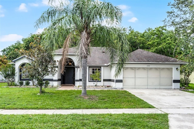 2888 Middleton Cir, Kissimmee, FL 34743 - view of front of property featuring stucco siding, an attached garage, roof with shingles, and driveway
