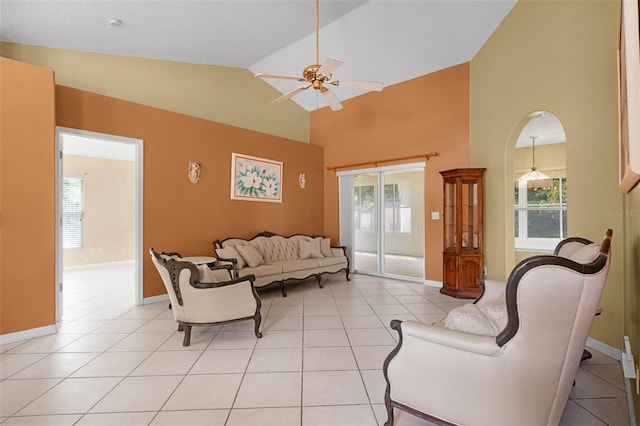 2888 Middleton Cir, Kissimmee, FL 34743 - living area with a ceiling fan, light tile patterned floors, high vaulted ceiling, and baseboards