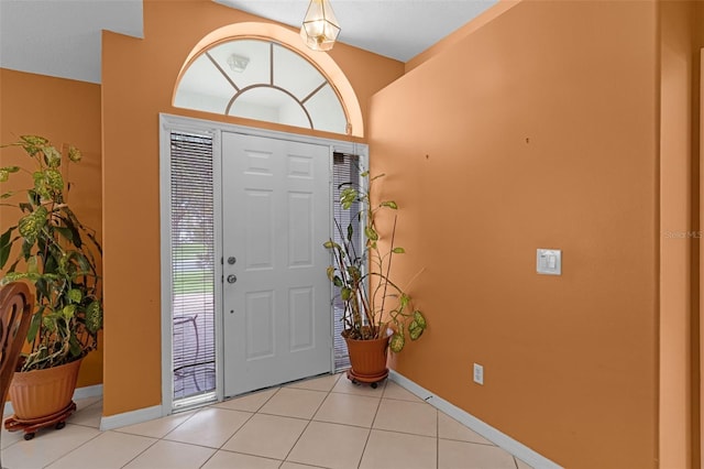2888 Middleton Cir, Kissimmee, FL 34743 - foyer entrance with baseboards and light tile patterned flooring