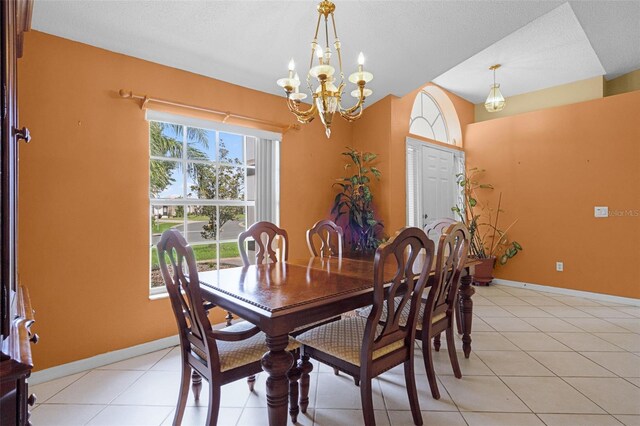 2888 Middleton Cir, Kissimmee, FL 34743 - dining area with a chandelier, baseboards, and light tile patterned floors