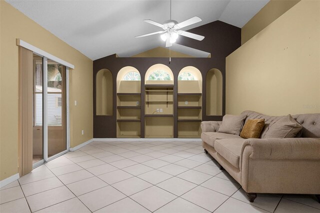 2888 Middleton Cir, Kissimmee, FL 34743 - living area with vaulted ceiling, a ceiling fan, light tile patterned floors, and baseboards