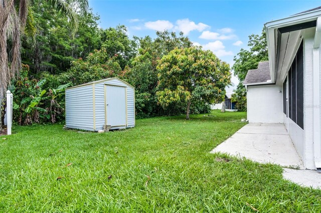 2888 Middleton Cir, Kissimmee, FL 34743 - view of grassy yard featuring a patio