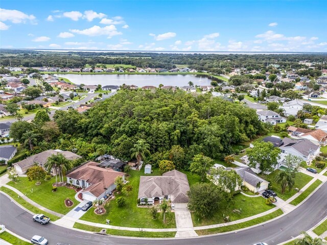 2888 Middleton Cir, Kissimmee, FL 34743 - view of property location with a nearby body of water, nearby suburban area, and a tree filled landscape