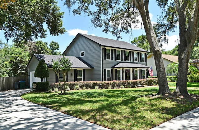 1462 Mt Laurel Dr, Winter Springs, FL 32708 - colonial house with concrete driveway and a garage