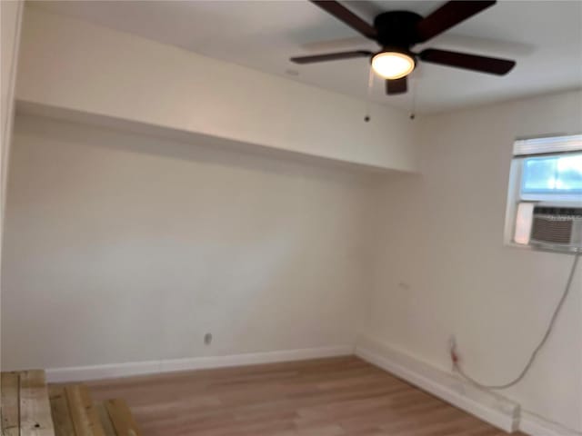 1834 28th Ave N, Saint Petersburg, FL 33713 - spare room featuring light wood-style flooring, a ceiling fan, cooling unit, and baseboards
