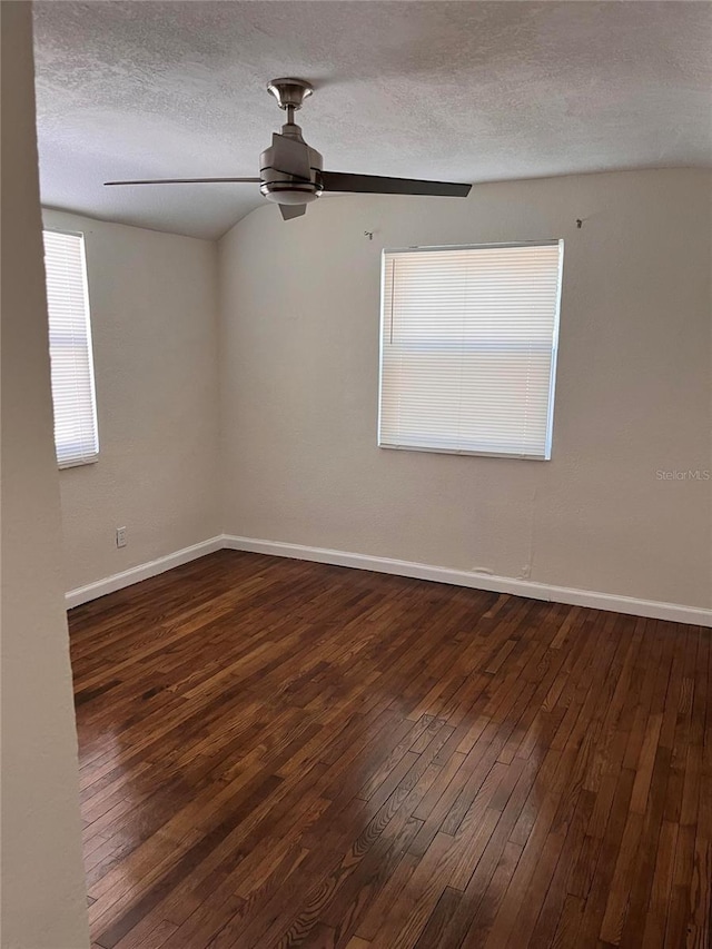 1834 28th Ave N, Saint Petersburg, FL 33713 - unfurnished room featuring a textured ceiling, hardwood / wood-style floors, baseboards, and a ceiling fan
