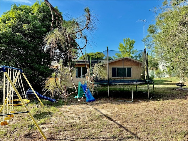 2 Clear Pl, Ocala, FL 34472 - back of house with a trampoline and a playground