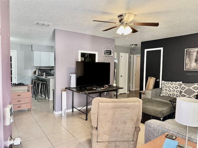 2 Clear Pl, Ocala, FL 34472 - living room featuring a ceiling fan, a textured ceiling, and light tile patterned floors