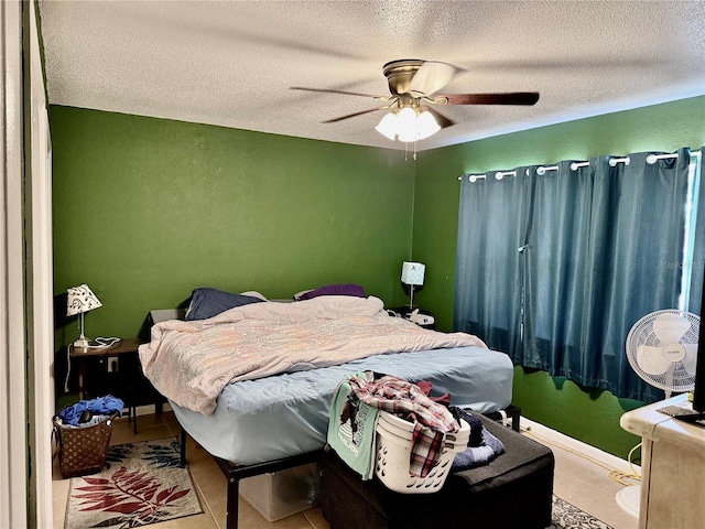2 Clear Pl, Ocala, FL 34472 - bedroom featuring a textured ceiling, a ceiling fan, tile patterned floors, and baseboards