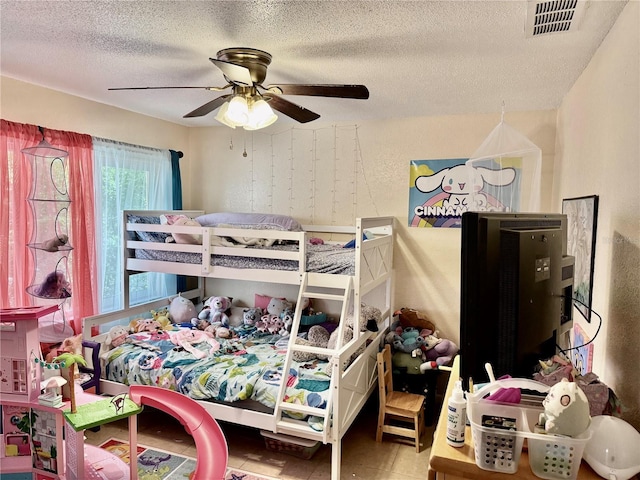 2 Clear Pl, Ocala, FL 34472 - bedroom with a textured ceiling and a ceiling fan