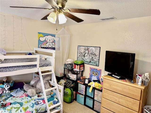 2 Clear Pl, Ocala, FL 34472 - tiled bedroom with a textured ceiling and ceiling fan