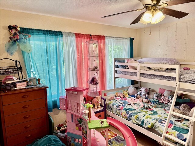 2 Clear Pl, Ocala, FL 34472 - bedroom featuring ceiling fan and a textured ceiling