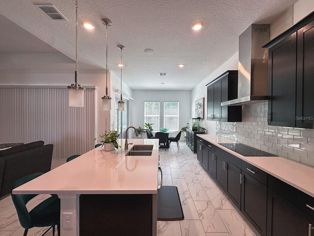 5161 Kingwell Cir, Oviedo, FL 32765 - kitchen featuring a sink, light marble finish flooring, wall chimney exhaust hood, light countertops, and a textured ceiling
