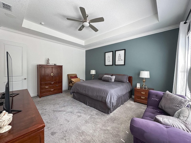 5161 Kingwell Cir, Oviedo, FL 32765 - bedroom featuring a tray ceiling, carpet floors, a textured ceiling, ceiling fan, and crown molding