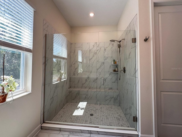 5161 Kingwell Cir, Oviedo, FL 32765 - full bath featuring a stall shower, marble look tiles, plenty of natural light, baseboards, and recessed lighting