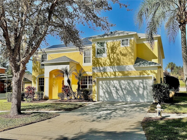 8520 La Isla Dr, Kissimmee, FL 34747 - traditional-style home with stucco siding, driveway, and a garage