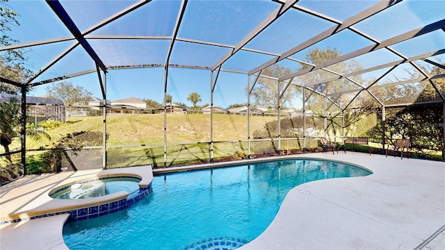 8520 La Isla Dr, Kissimmee, FL 34747 - view of swimming pool featuring glass enclosure, a pool with connected hot tub, and a patio area