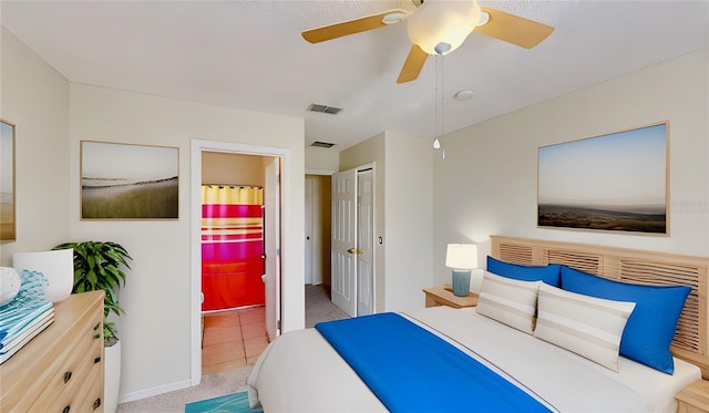 8520 La Isla Dr, Kissimmee, FL 34747 - bedroom with connected bathroom, a ceiling fan, carpet floors, and baseboards