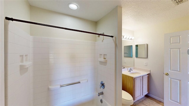 8520 La Isla Dr, Kissimmee, FL 34747 - full bath with shower / washtub combination, vanity, toilet, tile patterned flooring, and a textured ceiling