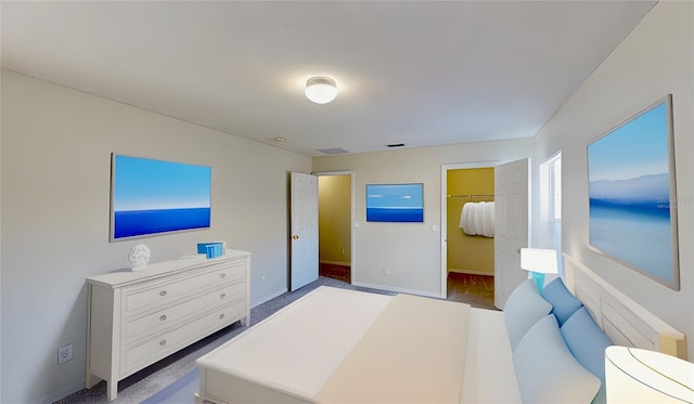 8520 La Isla Dr, Kissimmee, FL 34747 - bedroom featuring a walk in closet and baseboards