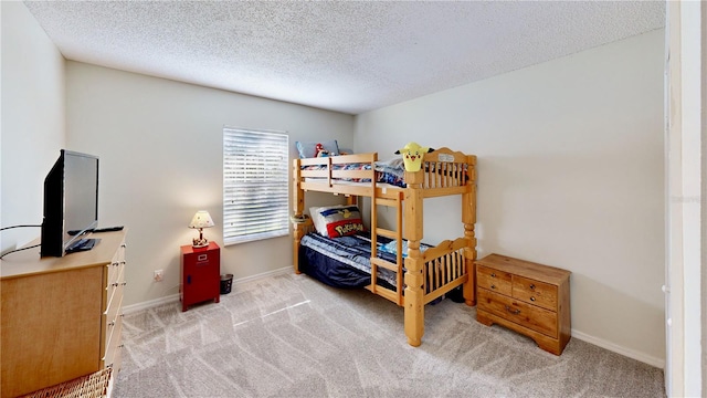 8520 La Isla Dr, Kissimmee, FL 34747 - bedroom featuring light colored carpet, a textured ceiling, and baseboards