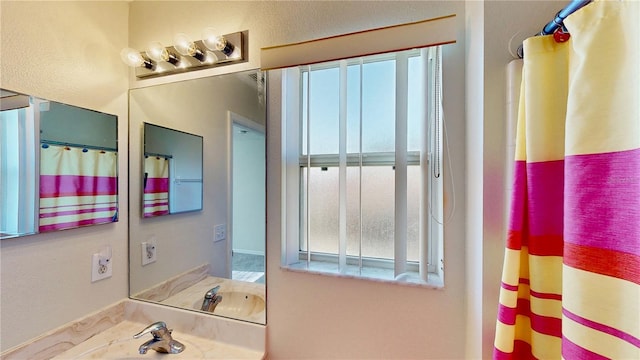 8520 La Isla Dr, Kissimmee, FL 34747 - full bathroom with vanity and a shower with shower curtain