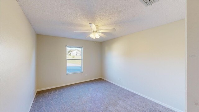 8520 La Isla Dr, Kissimmee, FL 34747 - unfurnished room featuring ceiling fan, carpet, a textured ceiling, and baseboards