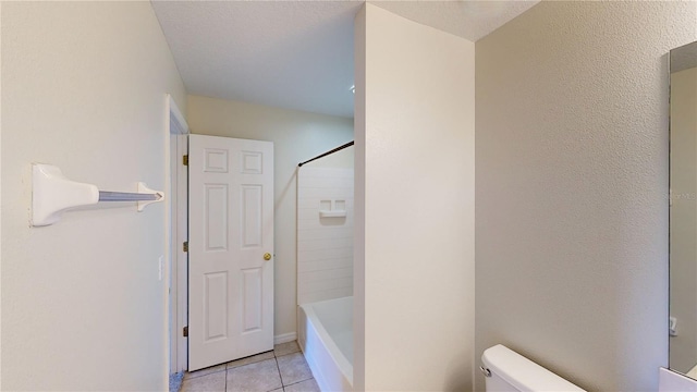8520 La Isla Dr, Kissimmee, FL 34747 - bathroom with toilet, tile patterned floors, and tub / shower combination