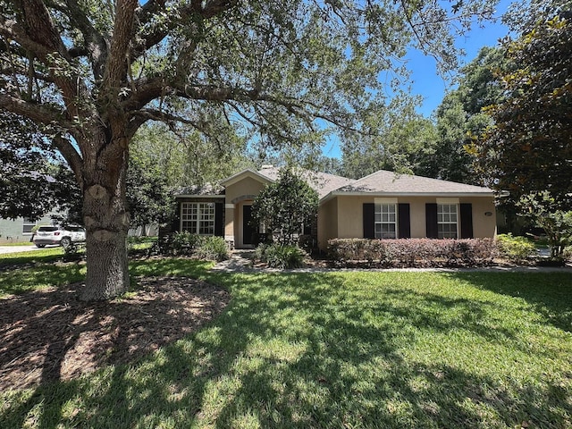 2585 Woodside Ridge Dr, Apopka, FL 32712 - ranch-style home featuring stucco siding and a front yard