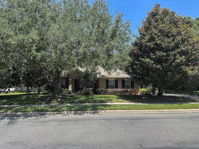 2585 Woodside Ridge Dr, Apopka, FL 32712 - view of front facade with a front lawn