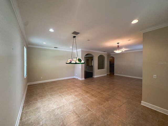 2585 Woodside Ridge Dr, Apopka, FL 32712 - empty room with arched walkways, crown molding, baseboards, and recessed lighting