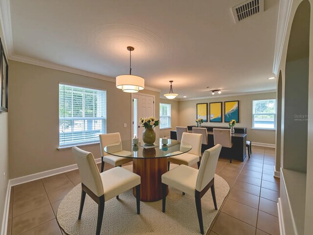 2585 Woodside Ridge Dr, Apopka, FL 32712 - dining space featuring baseboards, ornamental molding, light tile patterned floors, and recessed lighting
