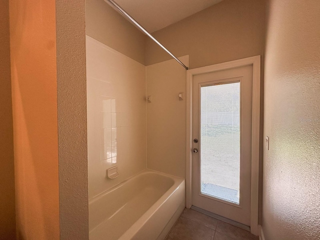 2585 Woodside Ridge Dr, Apopka, FL 32712 - full bathroom featuring shower / bathtub combination, tile patterned floors, and a textured wall