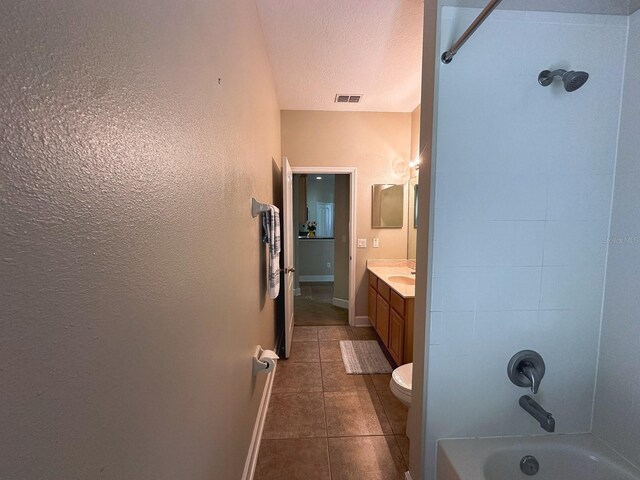 2585 Woodside Ridge Dr, Apopka, FL 32712 - full bath featuring vanity, bathing tub / shower combination, tile patterned floors, toilet, and baseboards