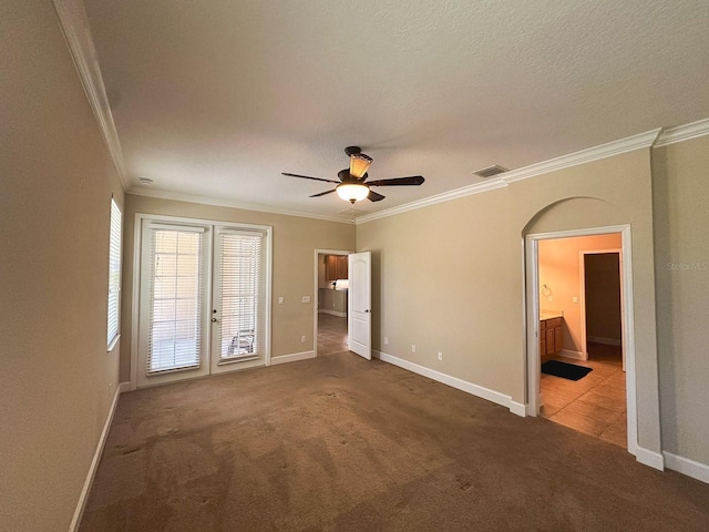 2585 Woodside Ridge Dr, Apopka, FL 32712 - unfurnished bedroom with crown molding, carpet floors, baseboards, ceiling fan, and ensuite bathroom