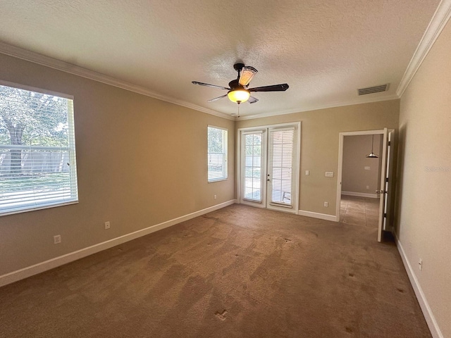 2585 Woodside Ridge Dr, Apopka, FL 32712 - empty room featuring ornamental molding, healthy amount of natural light, a textured ceiling, carpet, and baseboards