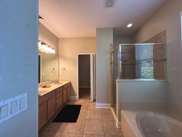 2585 Woodside Ridge Dr, Apopka, FL 32712 - bathroom with a stall shower, a jetted tub, double vanity, and tile patterned flooring