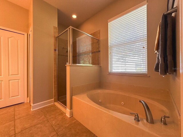 2585 Woodside Ridge Dr, Apopka, FL 32712 - full bathroom featuring a stall shower, a whirlpool tub, and tile patterned flooring