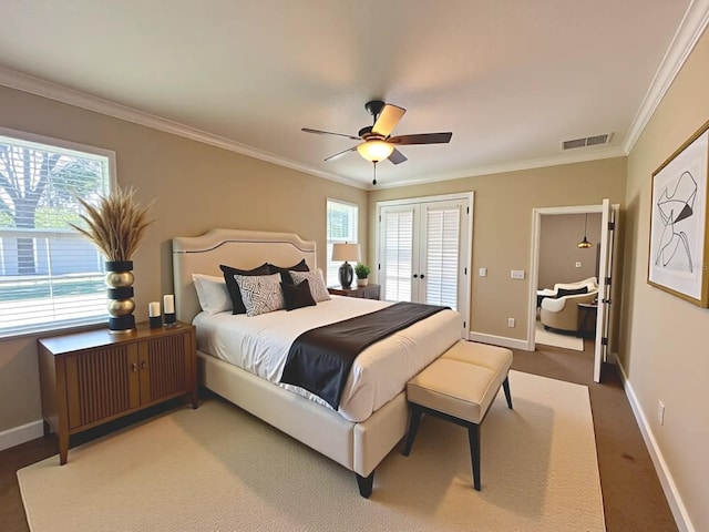 2585 Woodside Ridge Dr, Apopka, FL 32712 - bedroom with baseboards, crown molding, multiple windows, and french doors
