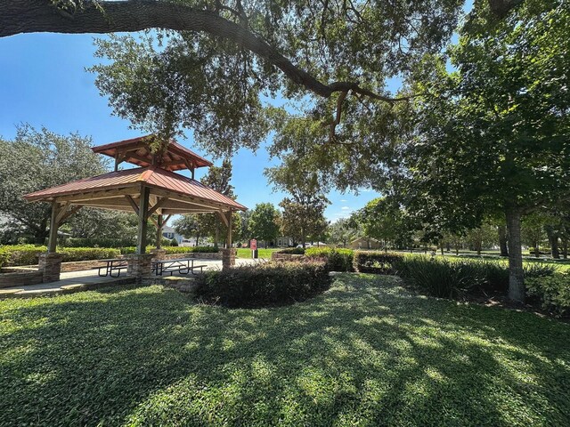 2585 Woodside Ridge Dr, Apopka, FL 32712 - view of grassy yard with a gazebo