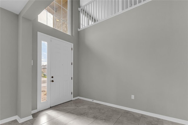 3137 Marine Grass Dr, Wimauma, FL 33598 - tiled entryway featuring baseboards and a high ceiling