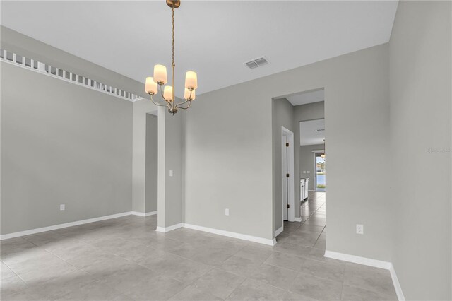 3137 Marine Grass Dr, Wimauma, FL 33598 - unfurnished room with a chandelier, baseboards, and light tile patterned flooring