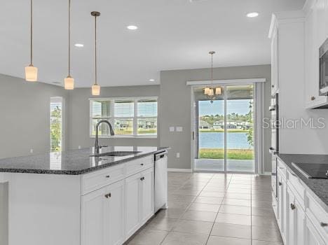 3137 Marine Grass Dr, Wimauma, FL 33598 - kitchen with a sink, stainless steel appliances, an island with sink, plenty of natural light, and recessed lighting